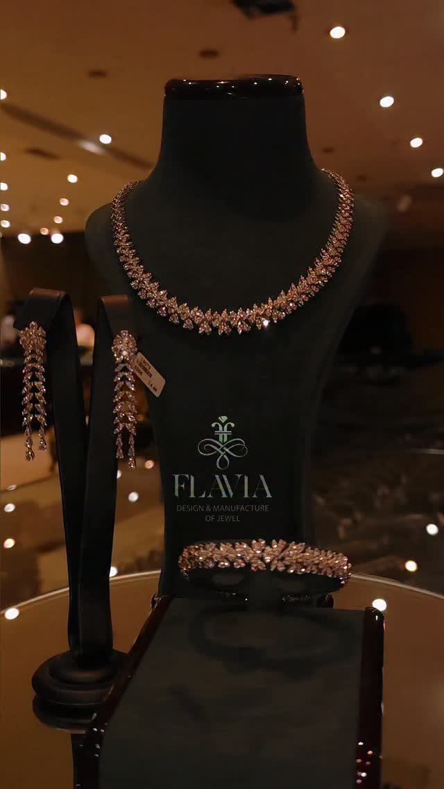 11 Bridal Diamond Necklace Ideas for Your Ceremony 5 Rose gold diamond necklace with matching earrings and bracelet displayed on black jewelry busts.