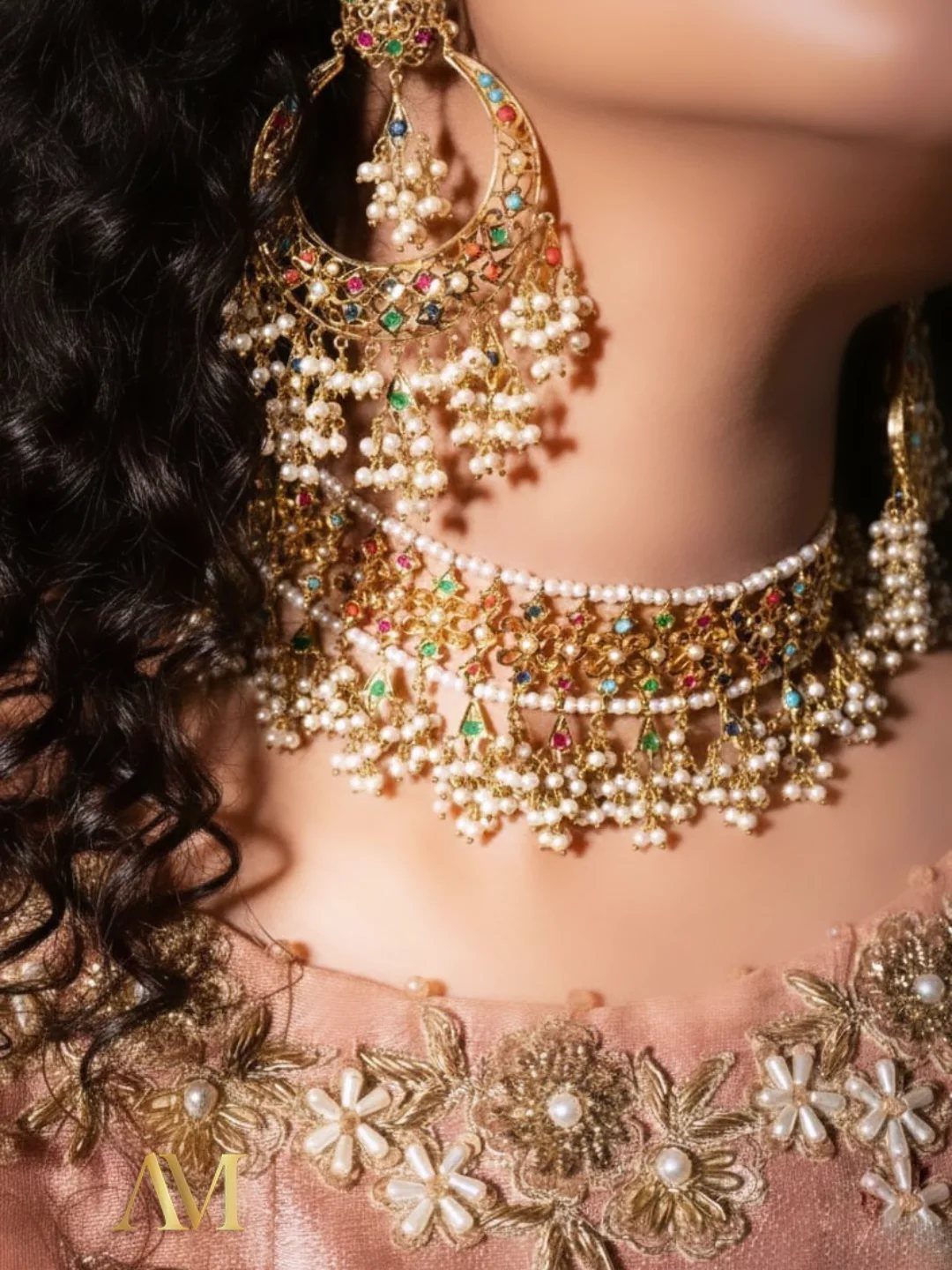Gold Kundan choker necklace with pearl drops and matching large Chandbali earrings on a person.