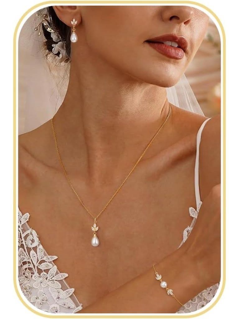 A woman wearing a gold pearl necklace, matching pearl earrings, and a gold pearl bracelet.